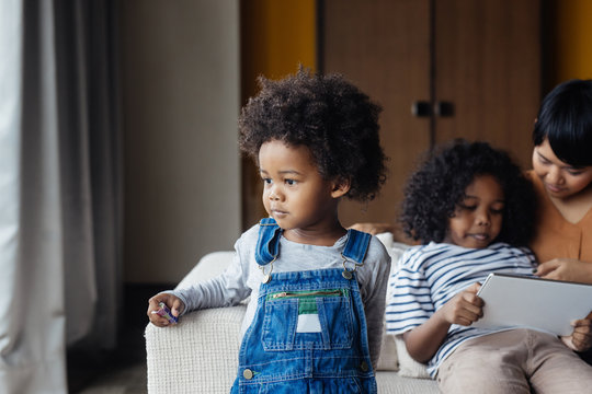 Cute Kid Standing at Living Room