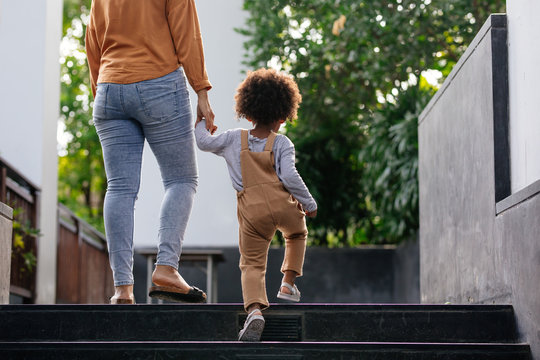 Mother and Child Holding Hands