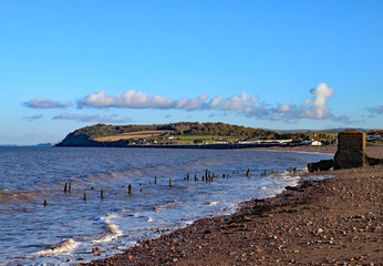 The deserted stony beach at Blue Anchor in Somerset, England