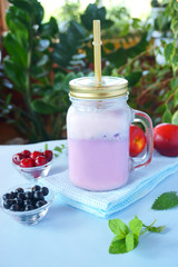 berries and milk smoothies, blue, pink, purple, coral