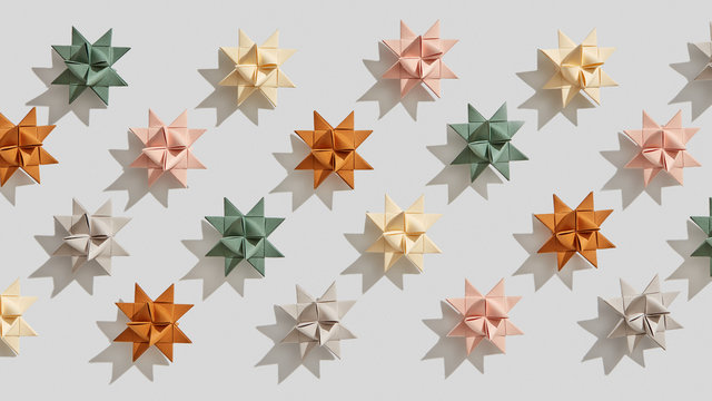 Multicolored paper origami stars presented on a gray background with shadows . Handcraft pattern. Flat lay