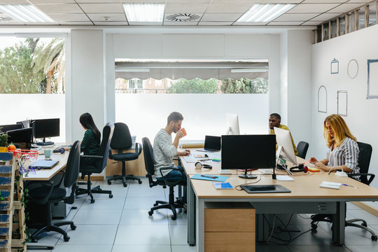 Diverse people working in stylish office