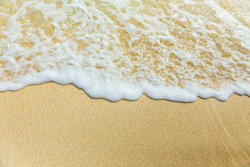 Sea surf, foam and sand