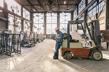 Blue Collar Worker Using Table at Work
