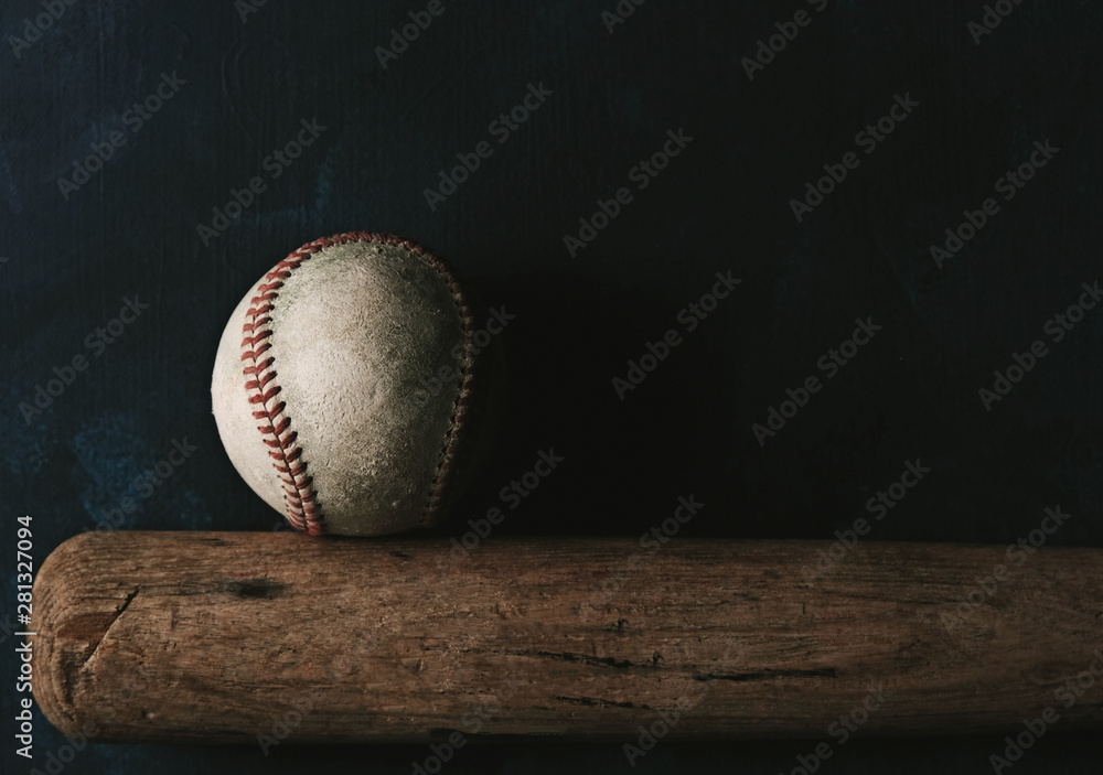 Wall mural baseball sport shows ball with bat on black background, moody and tough sports concept with copy spa - Wall murals