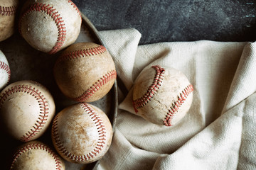 Group of old used baseballs on canvas background for baseball game equipment.