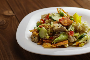 Tasty healthy dinner with chicken meat, fresh vegetables and rice, close up