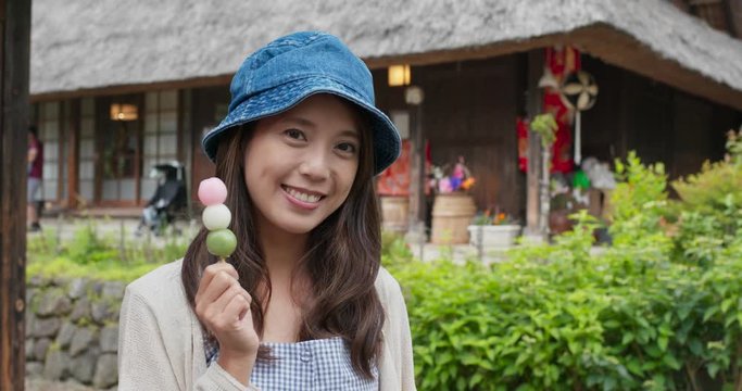 Woman hold with dango at Japanese house