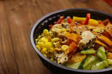 Tasty healthy dinner with chicken meat, fresh vegetables and rice, close up