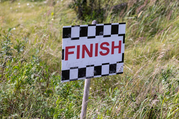 Finish sign in the grass lolly close up