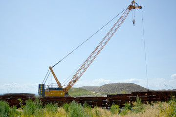 Fototapeta na wymiar Crane equipment working on highway construction site