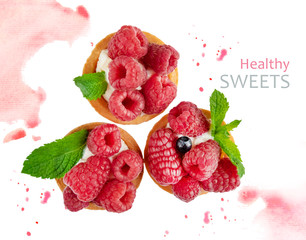 Tartlet with raspberry berries on a white background with watercolor pattern. Conceptual photo of useful sweets with berries. Design dishes for menus, flyers and discount coupons