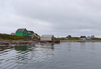 historical houses along the shorline of the fishing village on the Ile aux Marin Saint Pierre,...