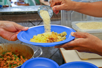 Giving school lunch  amazon Brazil