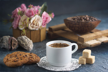 Fototapeta na wymiar Morning coffee with cookies and pieces of cane sugar, coffee beans and dried fruits