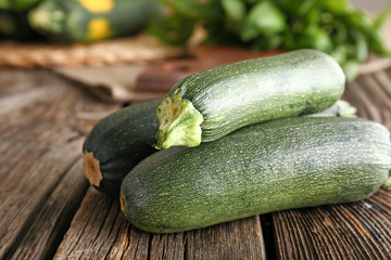 Fresh zucchini on wooden table