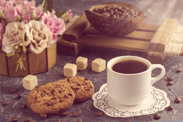 Morning coffee with biscuits and pieces of cane sugar in ray sun. Vintage style