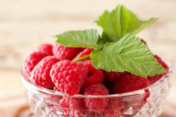 Bowl with fresh raspberries, closeup