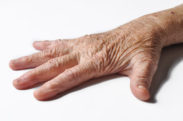 Old grandmother's hand isolated on a white background. Hand isolated on white background, copy space