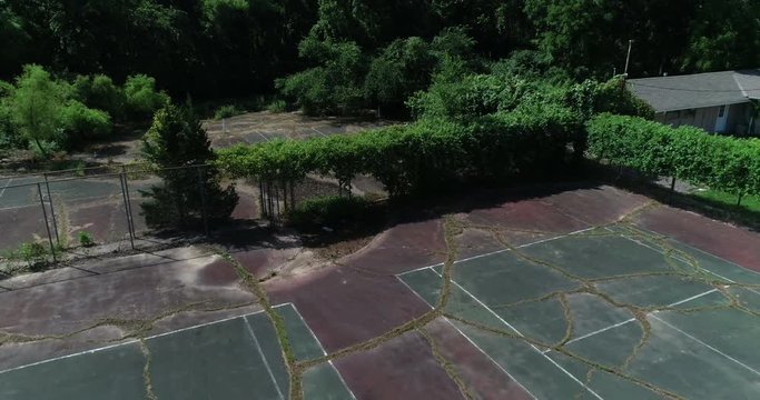 Aerial Drone Overgrown abandoned tennis courts