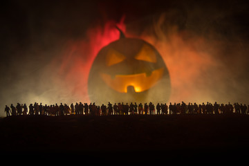 Blurred silhouette of giant monster prepare attack crowd during night. Selective focus.