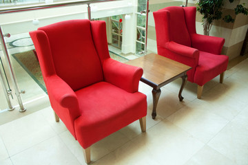 Red armchair in the hall