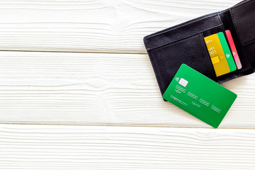 Pay by card concept and wallet on white wooden background top view mock up