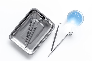 dentist desk with instruments on white background top view