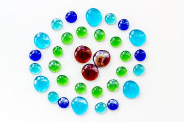Glass stones for design and home creativity on white background top view
