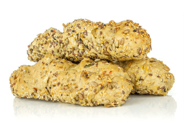 Group of three whole fresh cereal baguette heap isolated on white background