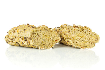 Group of two halves of crumbly fresh cereal baguette isolated on white background