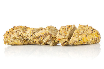 Group of five slices of fresh cereal baguette one sliced isolated on white background