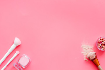 Instruments for make up with brushes, blusher on pink background top view mock up