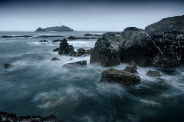 A long exposure of  a stormy sea around Godrevy lighthouse, Gwithian, Cornwall, England