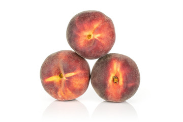 Group of three whole fresh red peach arranged in a pyramid isolated on white background