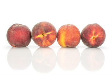 Group of four whole fresh red peach in a row isolated on white background