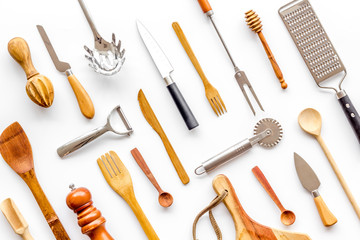 Chef work space with cookware on white background top view pattern