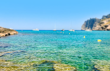 Selective focus, Shallow Transparent water and the beach of Mediterranean Sea on Majorca island