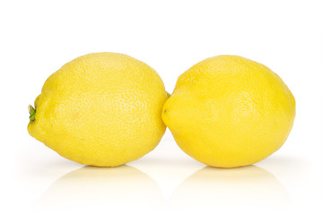 Group of two whole fresh yellow lemon isolated on white background