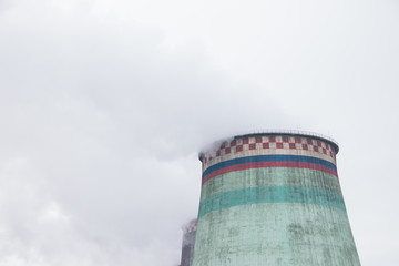 Smoke from the pipe of a thermal power plant. Smoke in the sky. Air pollution. Bad ecology.