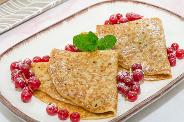 Crepes with berries and jam 