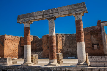 Fototapeta premium Ruins of the Forum at the ancient city of Pompeii in a beautiful early spring day