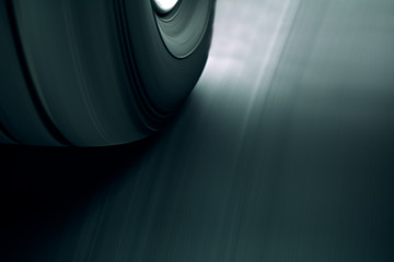 Close up of vehicle tire and rim rotation with blurry motion