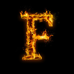 Letter F. Fire flames on black isolated background, realistick fire effect with sparks. Part of alphabet set