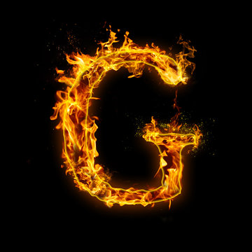 Letter G. Fire flames on black isolated background, realistick fire effect with sparks. Part of alphabet set