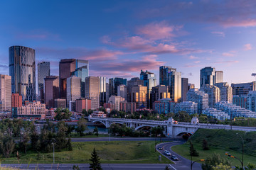 Fototapeta na wymiar Calgary's skyline along the Bow River at sunset. 