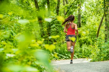 Poster Healthy active lifestyle woman runner jogging in forest path sport athlete training outdoor in green nature. Fit person working out. © Maridav