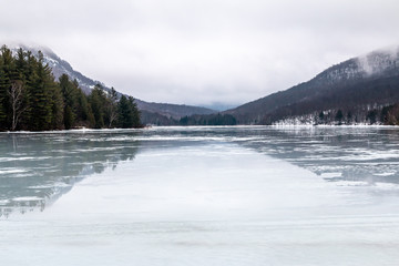 A frigid lake in the Adirondack Mountains.  - 281349646
