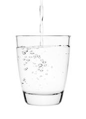 water pouring into a tumbler glass isolated on white background. with clipping path.
