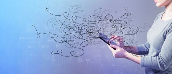 Solving a problem concept with business woman using a tablet computer